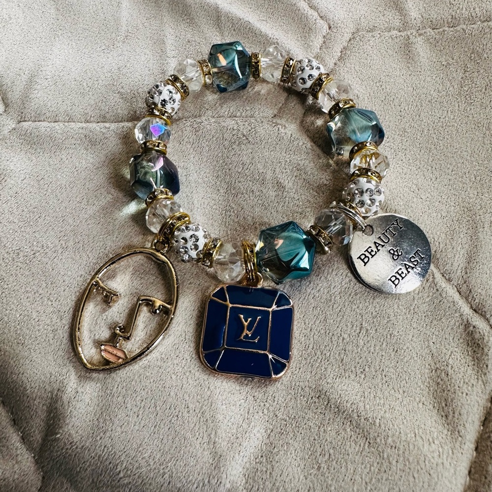 Elegant Gold and Blue Charm Bracelet